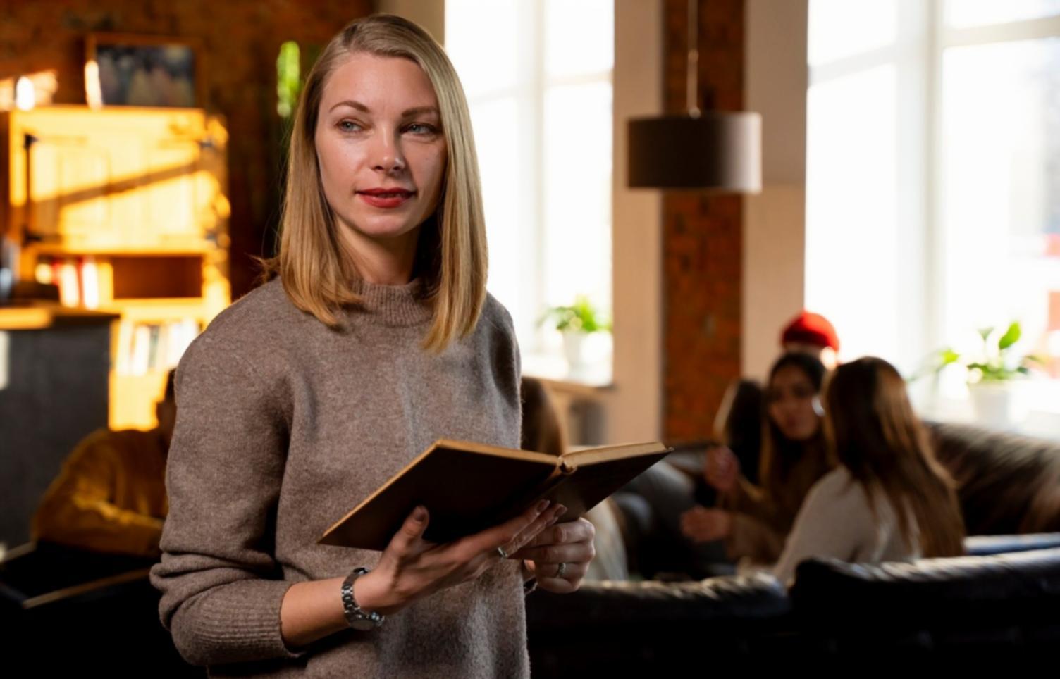 Professional budget negotiation training session with participants reviewing financial strategies